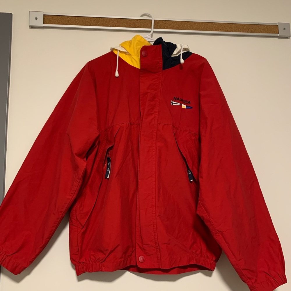 Red, vintage Nautica jacket with storable hood.